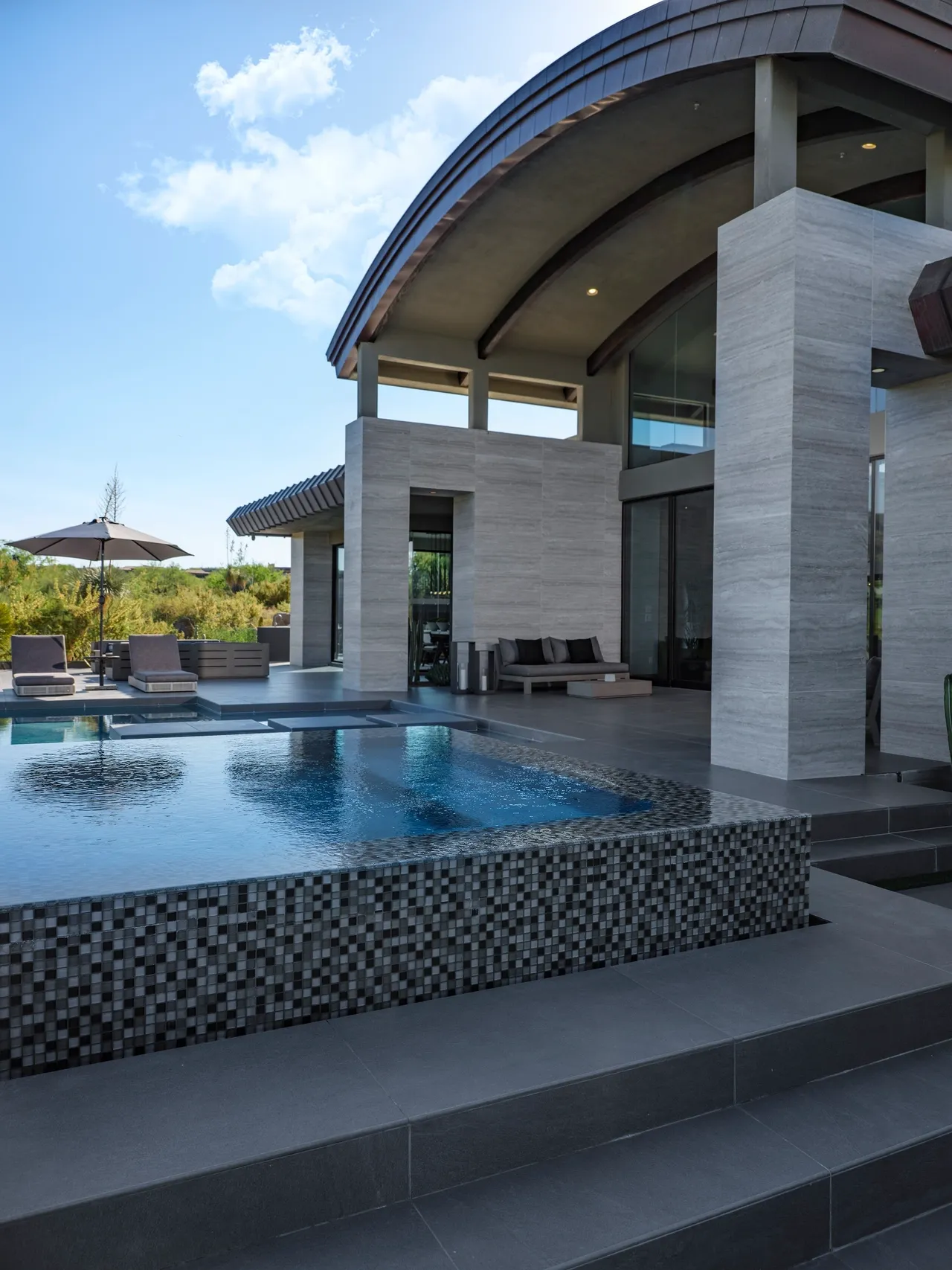 A large pool with a nice view of the outside.