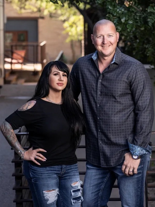 A man and woman standing next to each other.