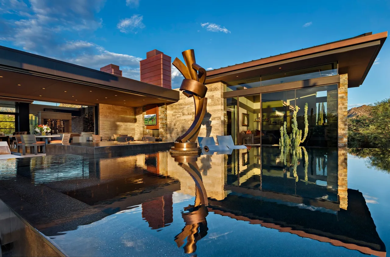 A sculpture of a person in the middle of water.