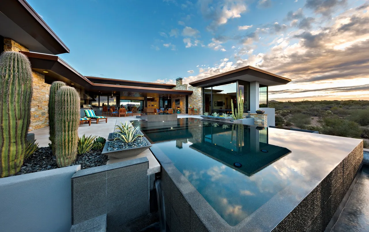 A pool with a large glass window in the background.