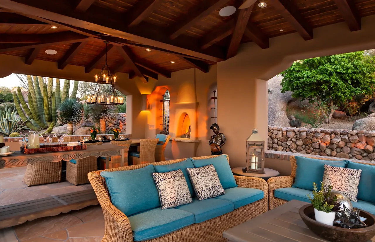 A living room with blue couches and chairs