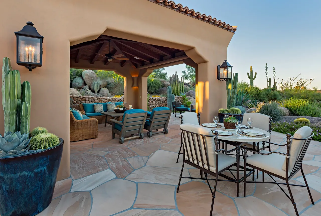 A patio with chairs and tables in it