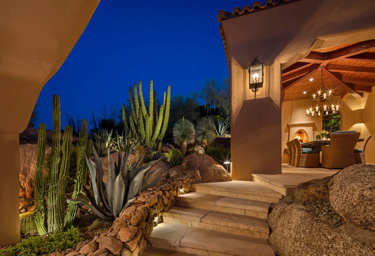 A night view of the front steps and patio.